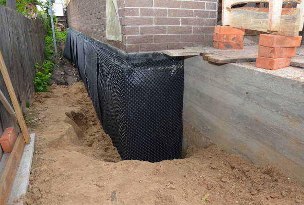 Happy homeowners after waterproofing job in Clanton